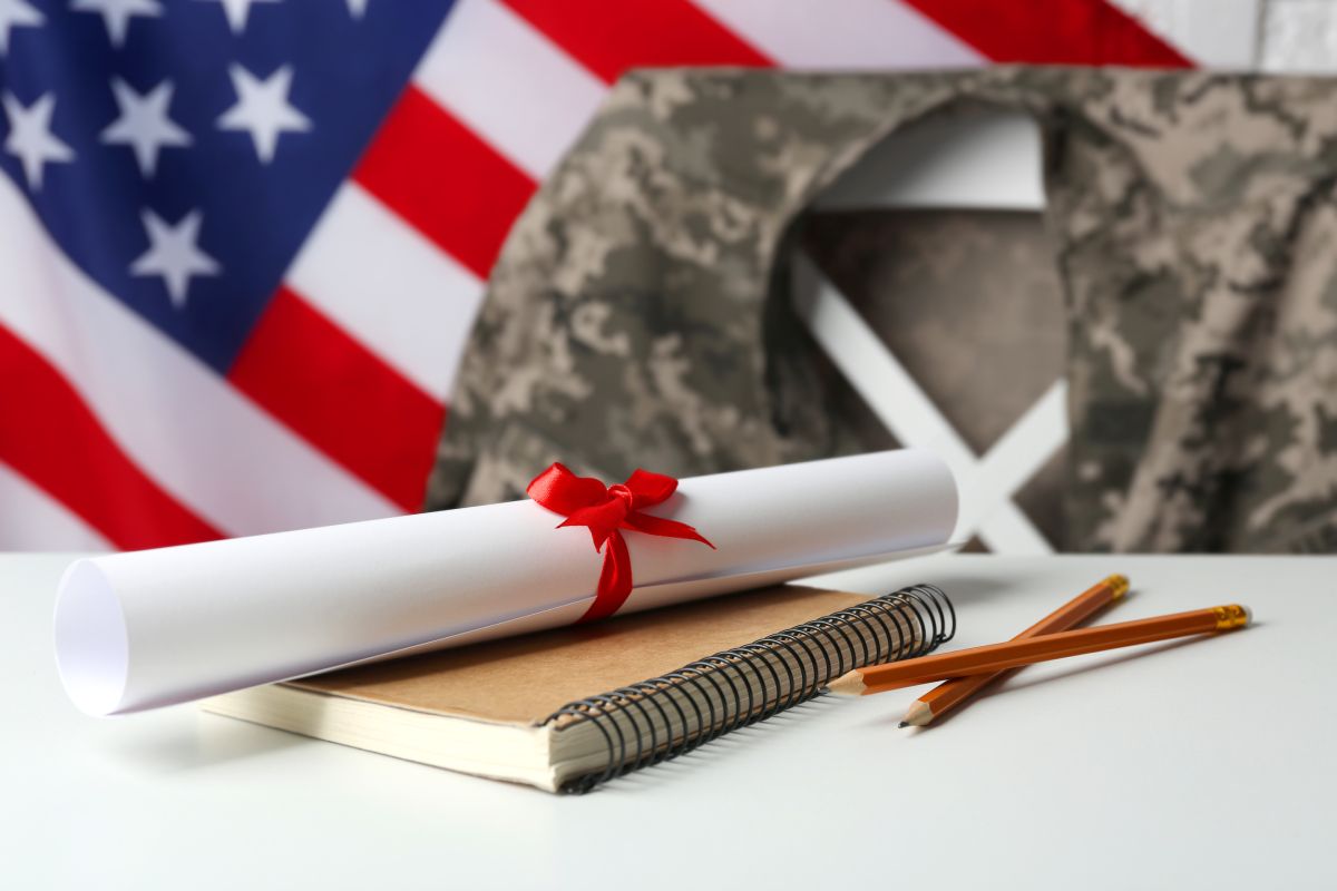 Diploma In Front Of An Active-Duty Military Uniform