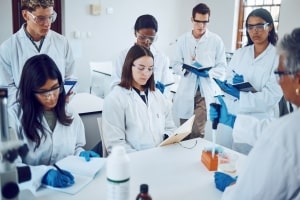 Mortuary Science Students in A Medical Laboratory Writing Notes