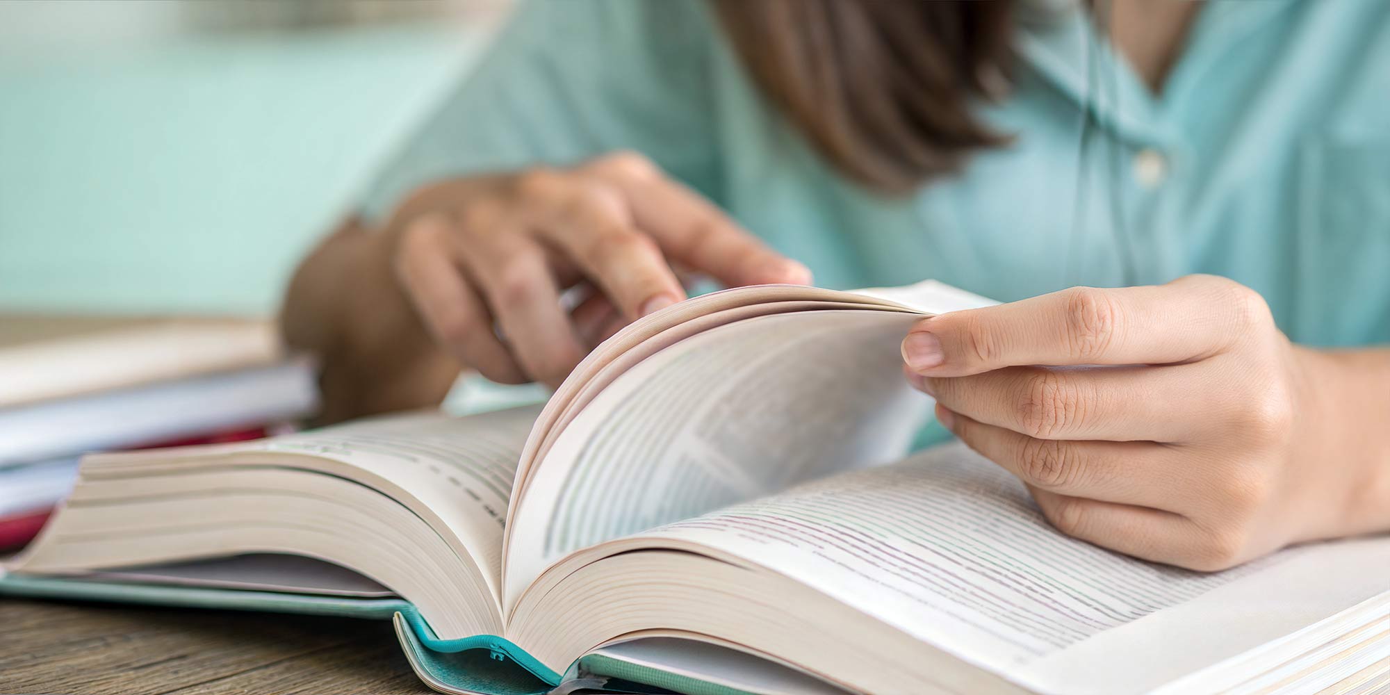 Student-Girl-Reading-Book-for-Exam