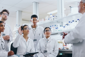 Students Asking Questions to Professor in Lab