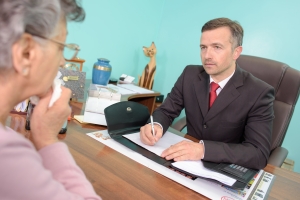 Funeral Director Talking to Bereaved Woman