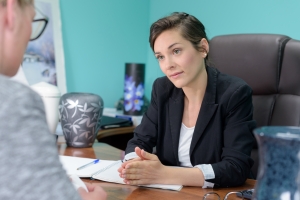 Funeral Services Professional Talking to Client