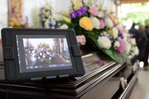 A Digital Funeral Setup Featuring A Livestream Tablet