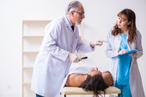 Experienced Trainer Educating A Mortuary Science Student