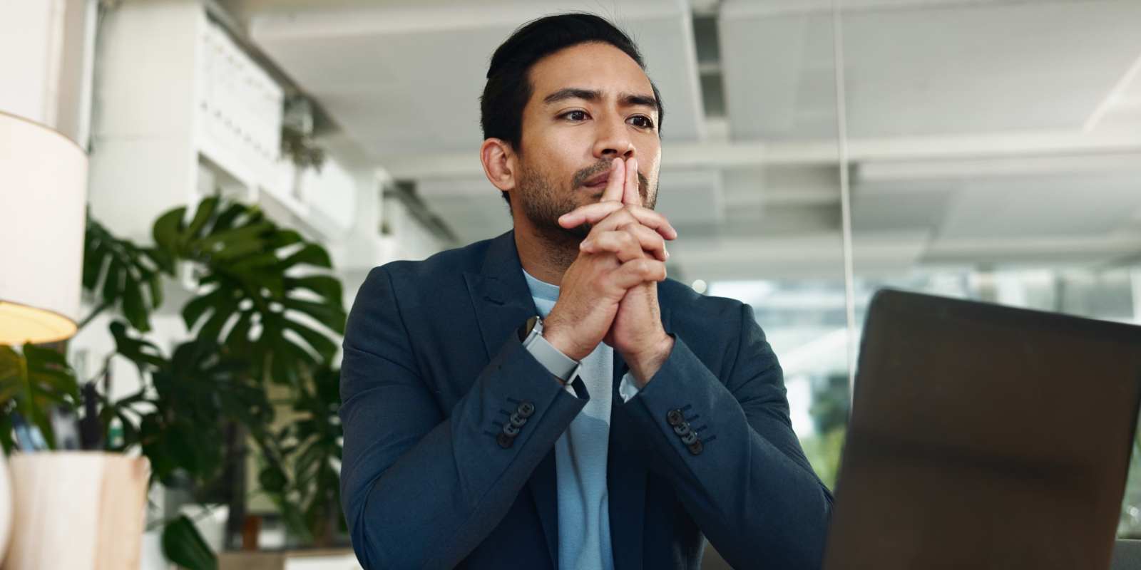 Man Sitting with Laptop Thinking about Career Change