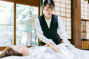 Young Woman Performing Mortuary Care and Embalming on A Body