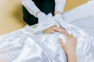 Embalmer Cleansing the Body for Funeral Ceremony