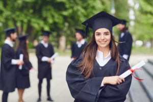 Female Mortuary Science Student Standing with Her Degree