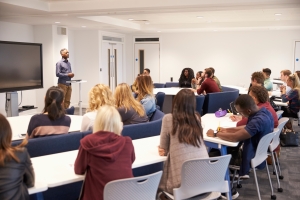 Mortuary Science Students Studying in Classroom with Male Lecturer