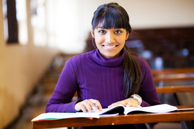 beautiful young female college student in classroom