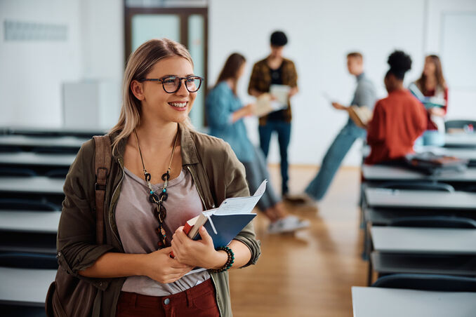 female college student in lecture hall looking away